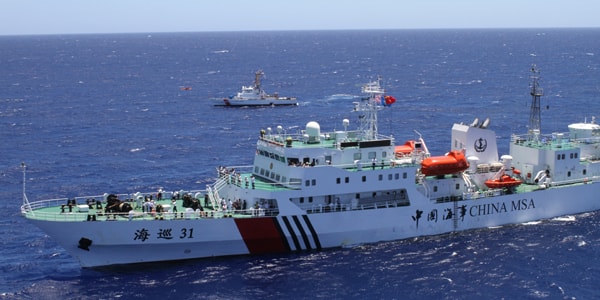 The crew of the U.S. Coast Guard Cutter Galveston Island (background), home ported in Honolulu, is underway alongside the crew of the People's Republic of China Maritime Safety Administration ship Haixun 31 (foreground) eight miles offshore of Honolulu, Sept. 6, 2012. The ships took part in a joint rescue exercise which included Haixun 31's helicopter crew and an MH-65 Dolphin helicopter crew from Coast Guard Air Station Barbers Point. U.S. Coast Guard photo by Petty Officer 2nd Class Eric J. Chandler.